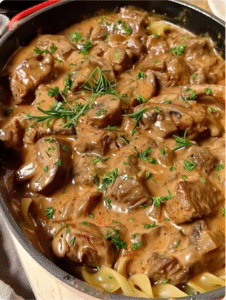 “Creamy Beef Stroganoff over Egg Noodles